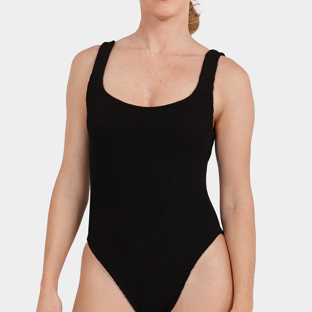 Model wearing the one size crinkle swimsuit in midnight black