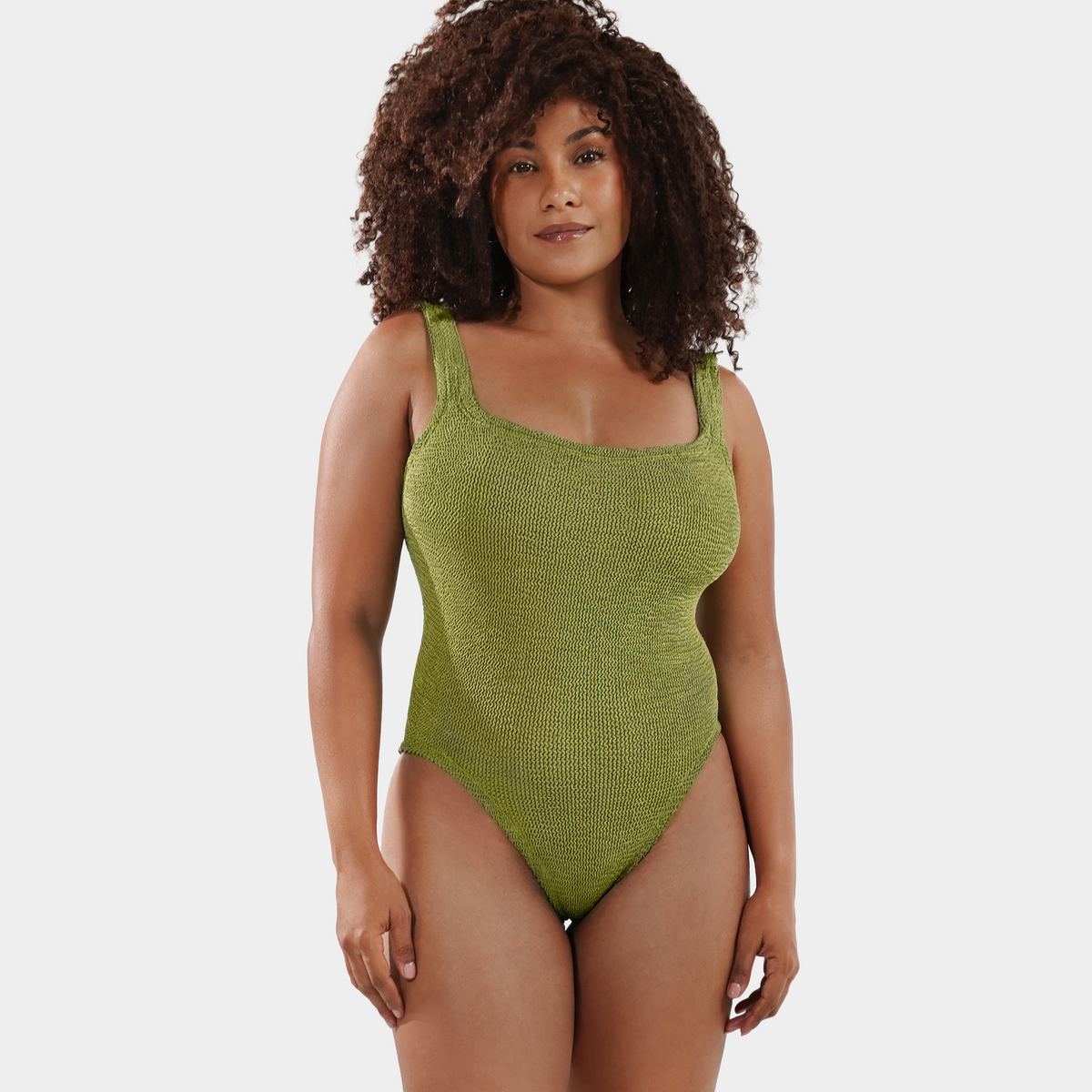 Model wearing the one size crinkle swimsuit in golden sage