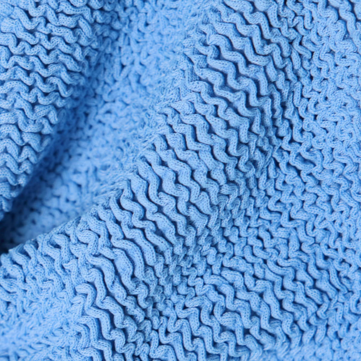 Close-up of the crinkle fabric texture in cornflower blue