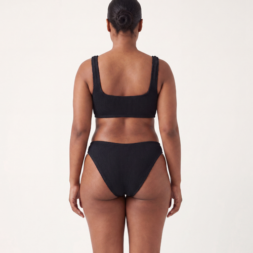 Back view of the Amalfi bikini with low waisted bottoms in midnight black